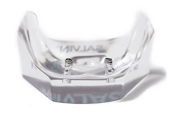 Mini dental implants in plastic model